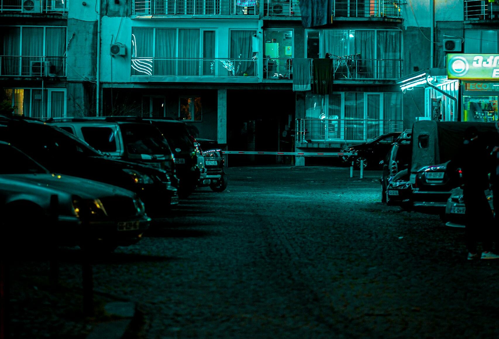 A building lit up in blue at night