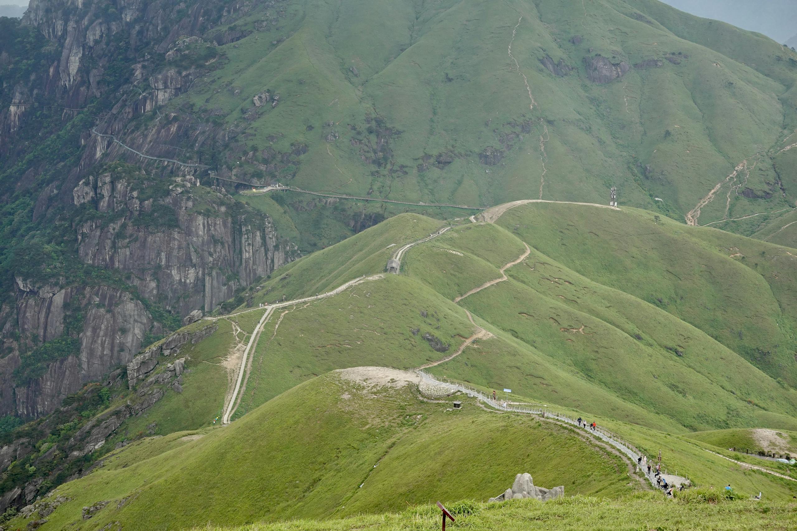 A mountain road with a winding path leading up to it